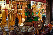 Chiang Mai - Wat Phra That Doi Suthep. The innercourtyard of the temple is filled with Buddha statues and other religious paraphenalia. 